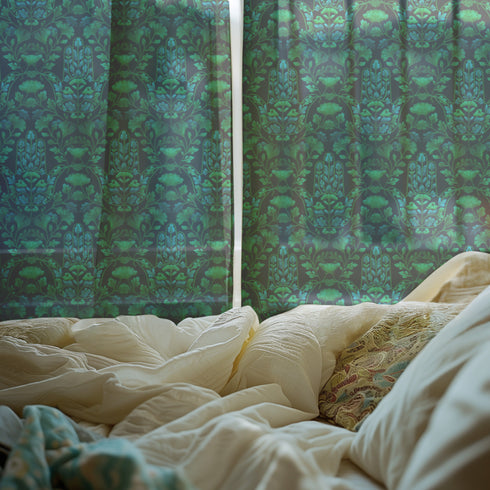 Sheer curtain panel featuring repeating emerald green hamsa hands with blue botanical elements on dark background. Linen-textured polyester fabric filters light beautifully while providing elegant window covering with protective symbolism for bohemian or Victorian interiors.
